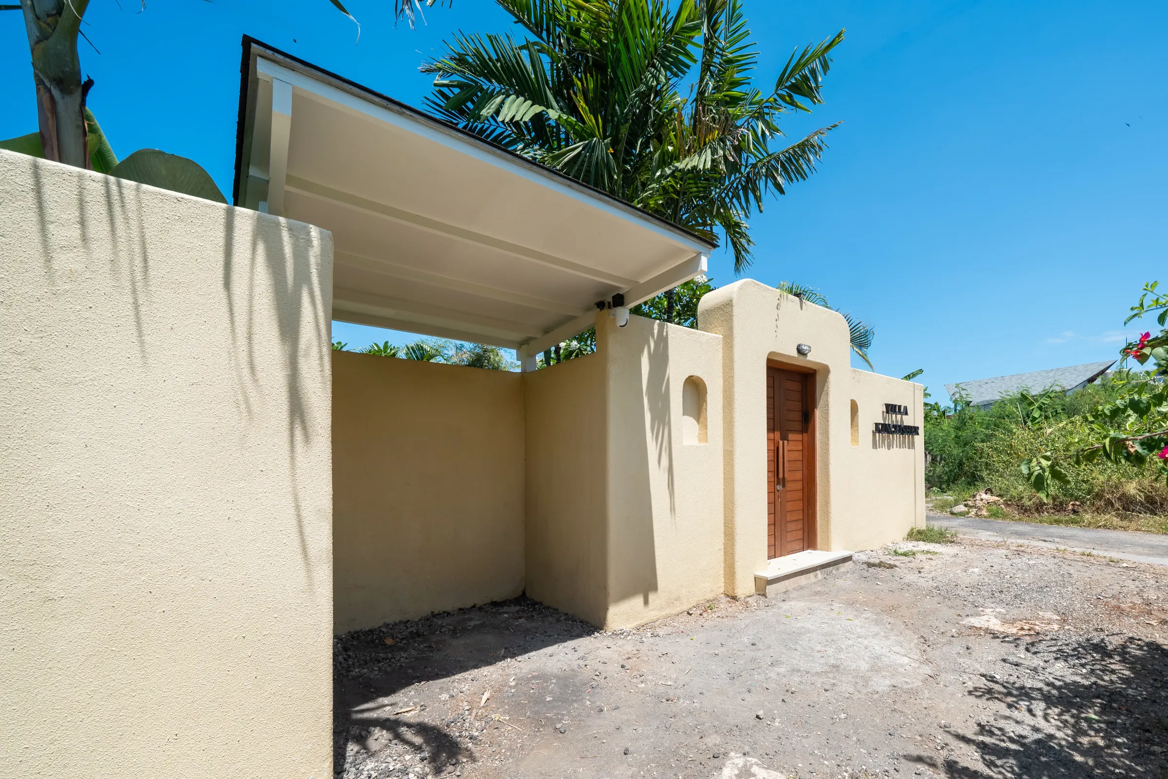 Entrance gate with a timber door