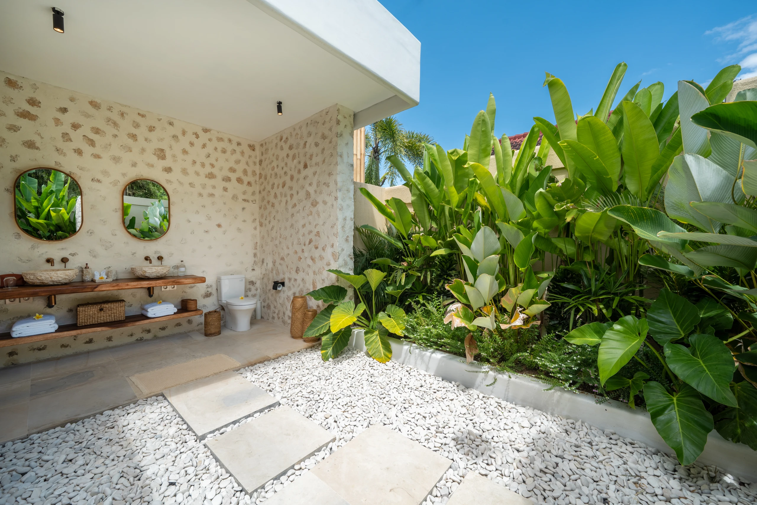 Tropical bathroom with lush greenery view