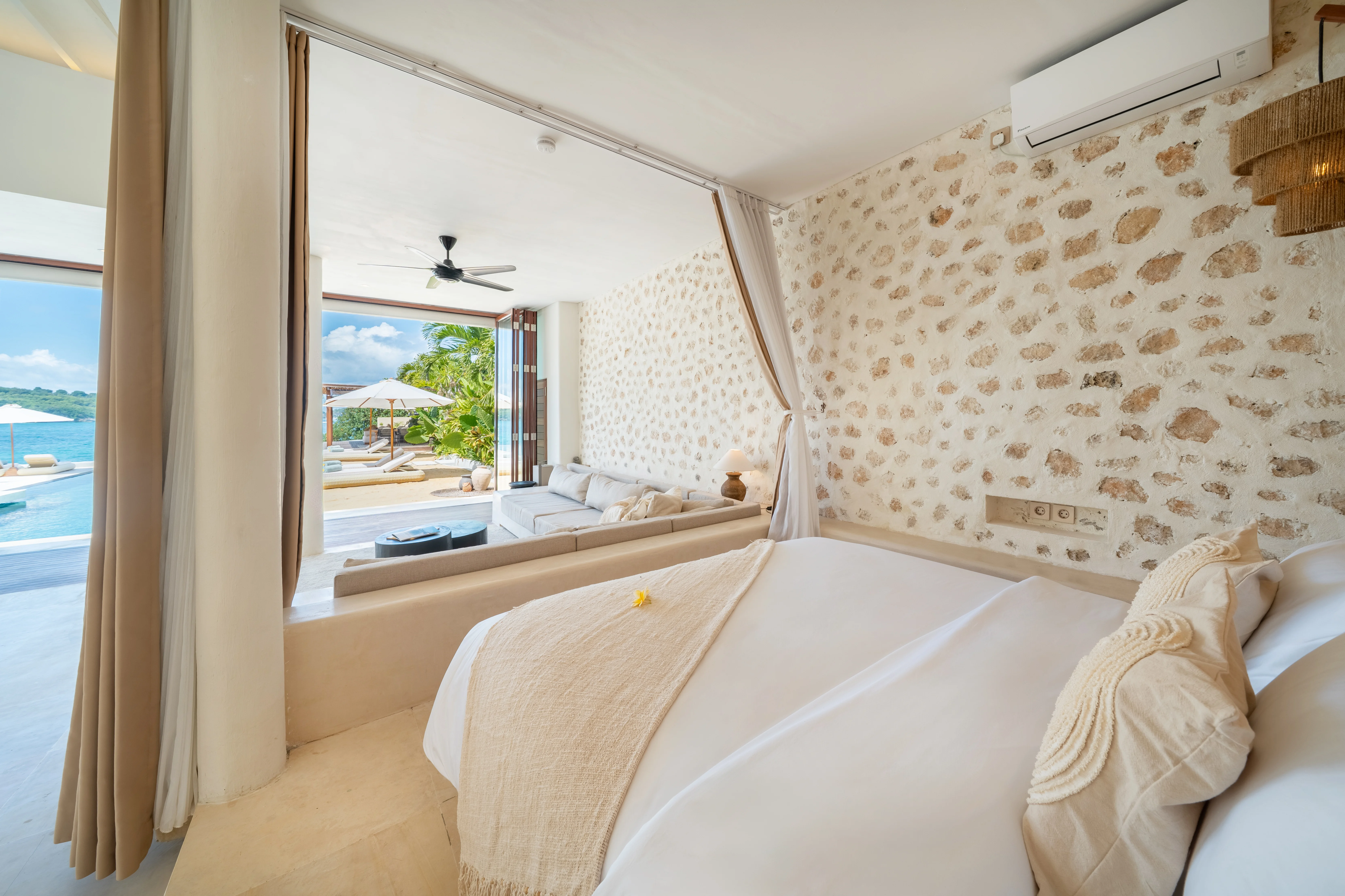 Four-poster bed with an ocean-view window
