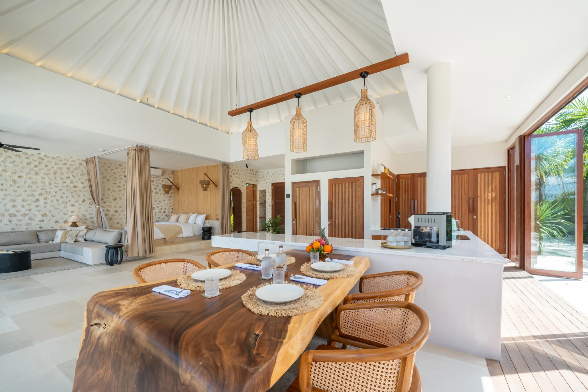 Open living and dining pavilion with hand-carved teak table