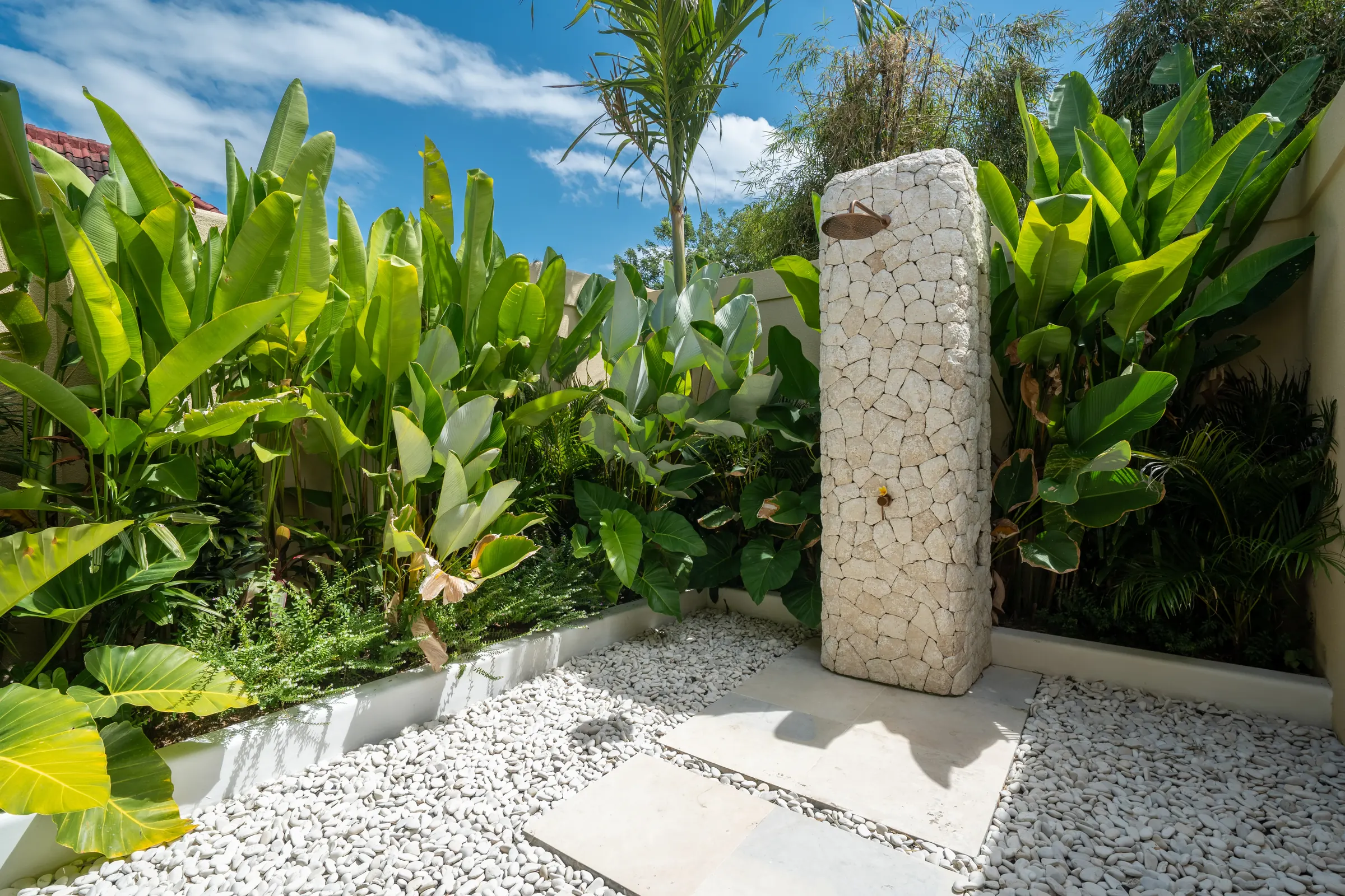 Garden shower amid tropical planting