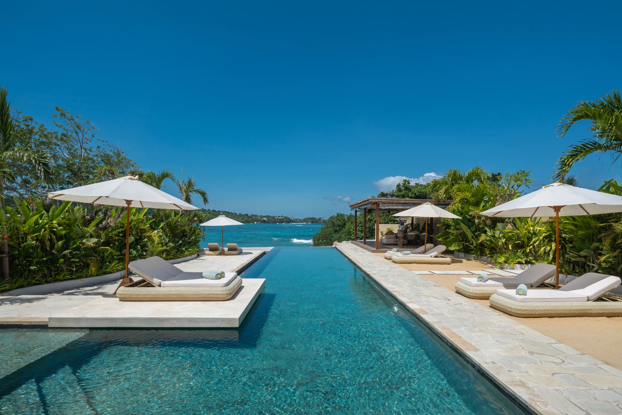 The 20-metre infinity pool stretching toward the turquoise ocean at Villa Kingfisher, Nusa Lembongan